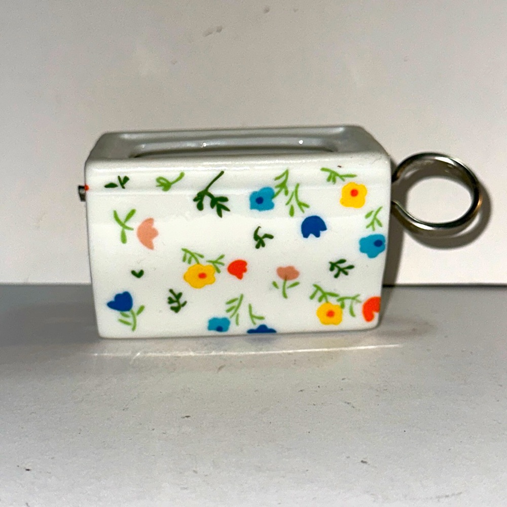 Vintage floral stamp dispenser. Made in Japan.